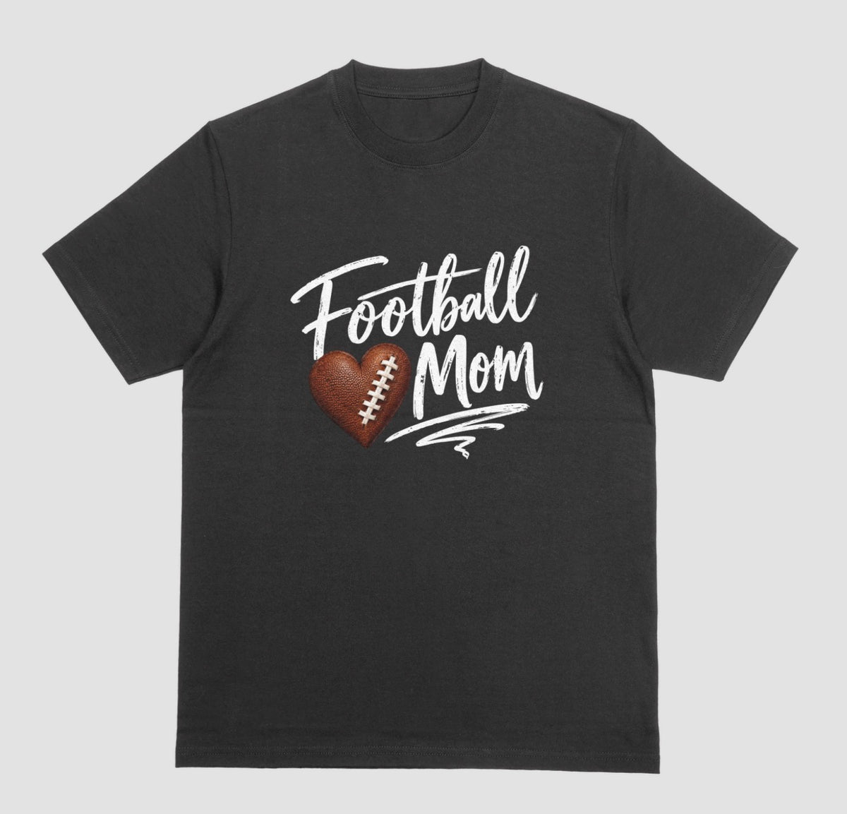 A black crewneck T-shirt featuring 'Football Mom' text in black script lettering, with a football-textured heart design between the words
