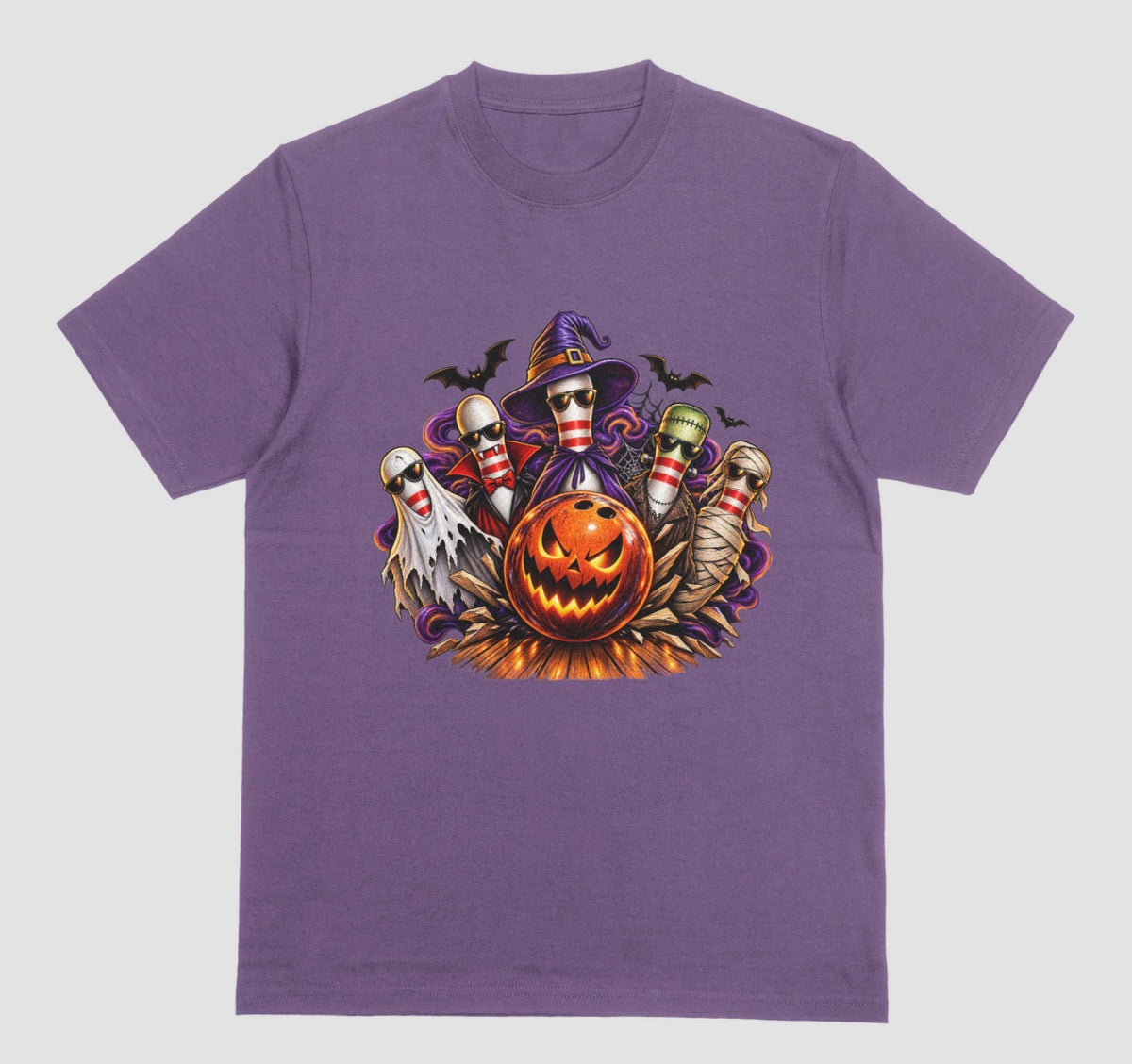 A purple Halloween bowling t-shirt featuring a graphic of five bowling pins dressed as a ghost, vampire, witch, Frankenstein's monster, and mummy, all wearing sunglasses, behind a glowing jack-o'-lantern bowling ball