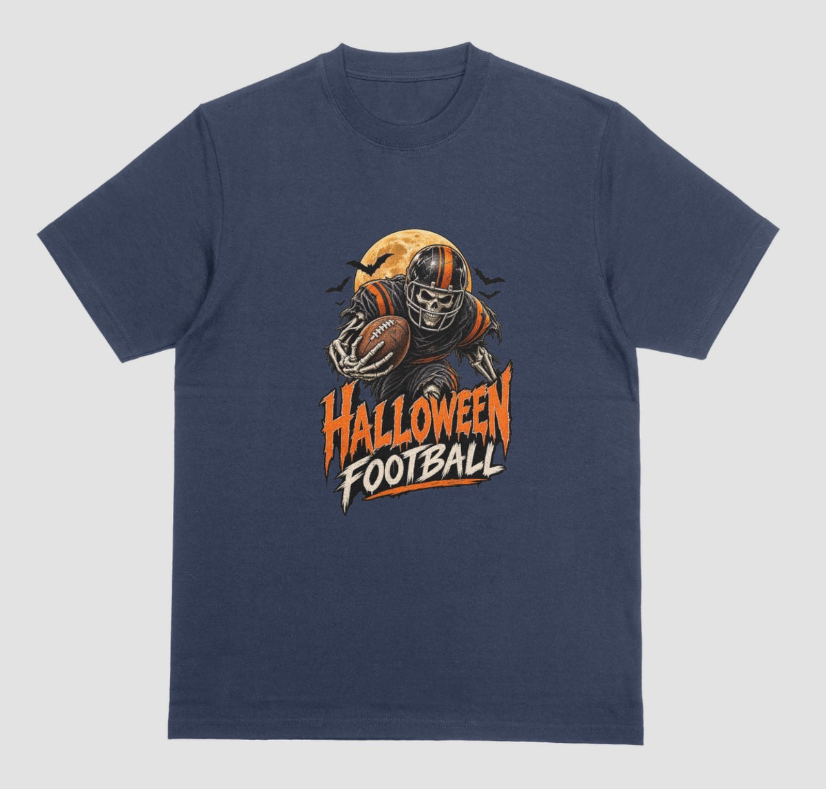A navy blue t-shirt reading "Halloween Football" in orange and cream lettering, with a skeleton football player in a striped helmet carrying a football in front of a full moon and bats