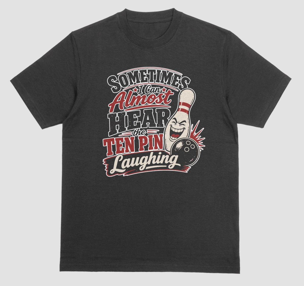 A black t-shirt with the funny bowling quote "Sometimes I Can Almost Hear the Ten Pin Laughing" in red, black, and cream lettering beside a laughing bowling pin and black bowling ball