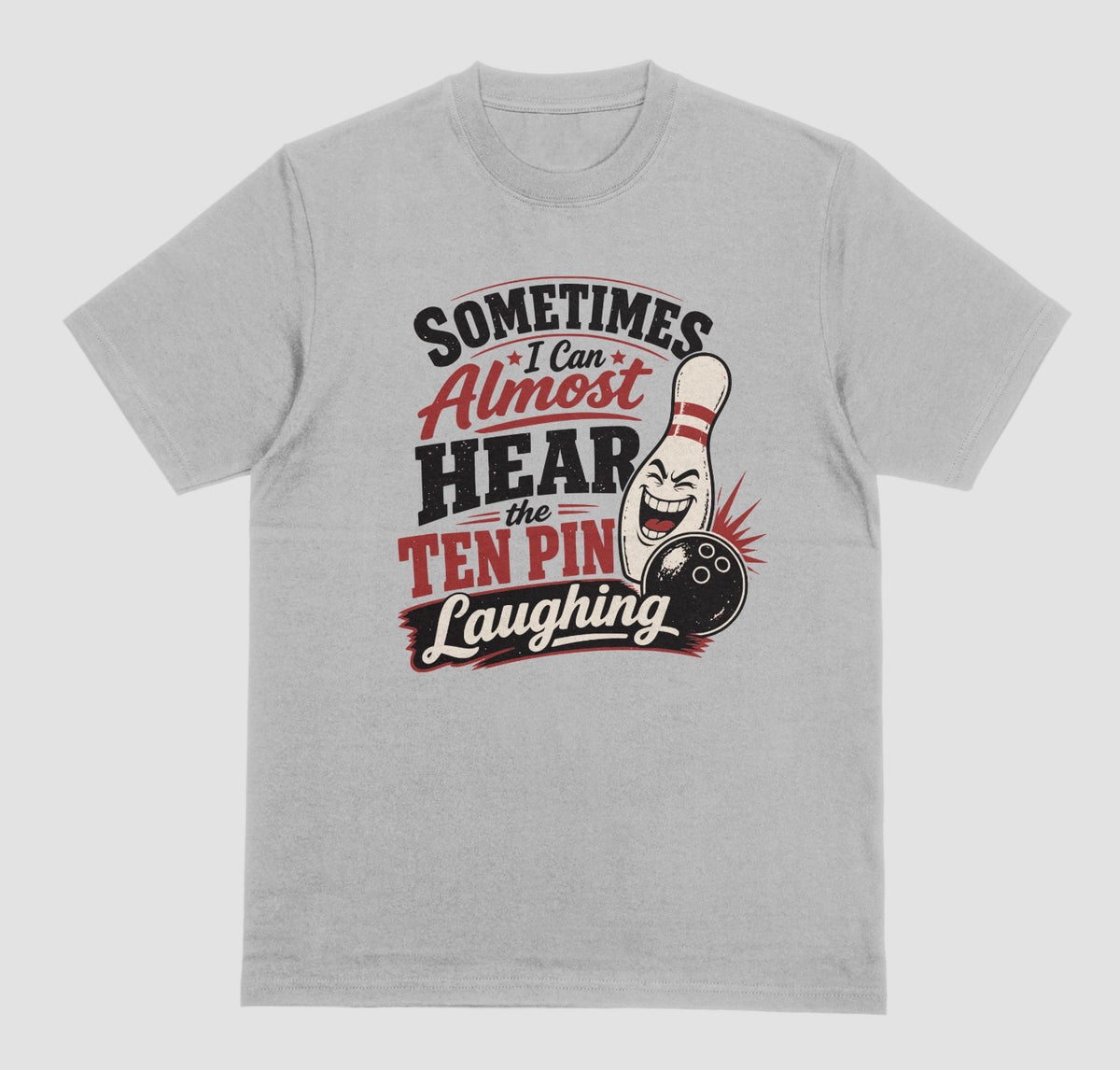A grey t-shirt with the funny bowling quote "Sometimes I Can Almost Hear the Ten Pin Laughing" in red, black, and cream lettering beside a laughing bowling pin and black bowling ball