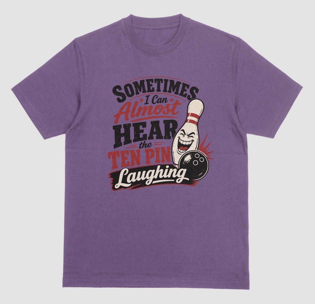 A purple t-shirt with the funny bowling quote "Sometimes I Can Almost Hear the Ten Pin Laughing" in red, black, and cream lettering beside a laughing bowling pin and black bowling ball