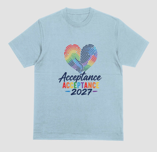 A light blue crewneck t-shirt featuring a graphic on the front with a rainbow-striped heart made of fingerprint patterns and the text 'Acceptance 2027' in dark blue and rainbow colors.