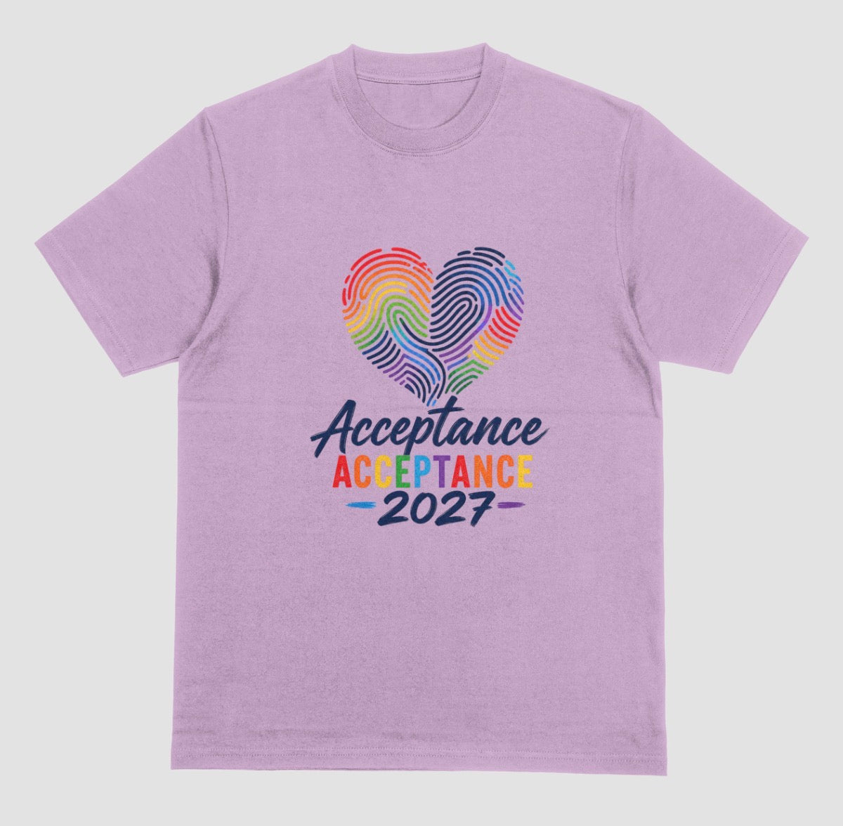 A lilac crewneck t-shirt featuring a graphic on the front with a rainbow-striped heart made of fingerprint patterns and the text 'Acceptance 2027' in dark blue and rainbow colors.