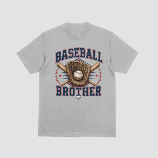A light gray heather crewneck t-shirt featuring a baseball-themed graphic on the front with the words 'BASEBALL BROTHER' in navy and red, a baseball glove, crossed bats, a baseball, and red stitching details.