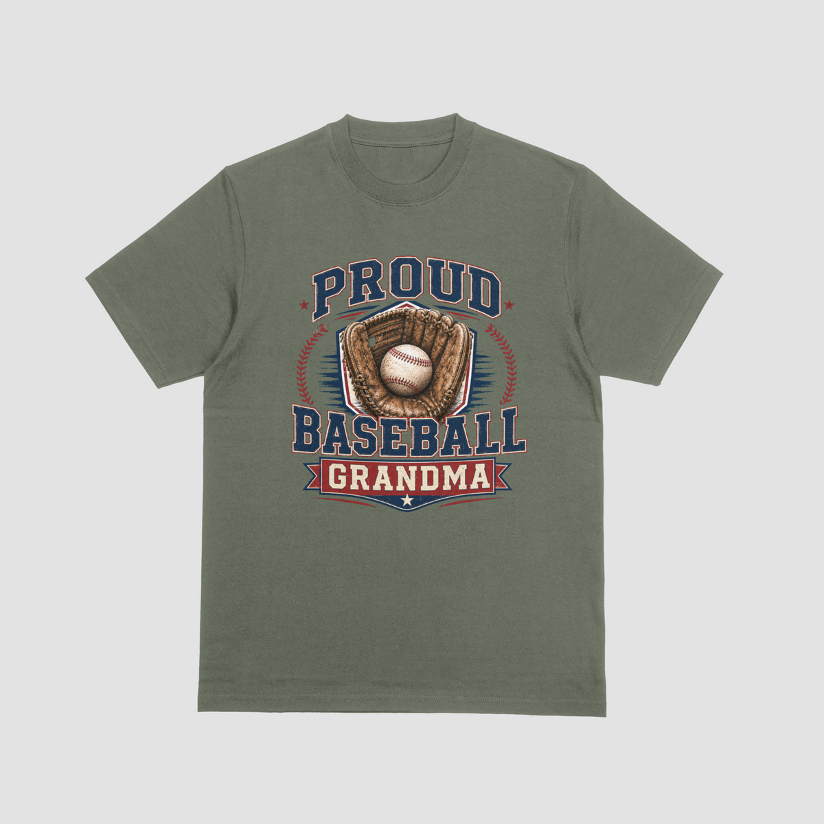 A military green short-sleeve crewneck t-shirt with a vintage-style baseball graphic on the front. The graphic features the text 'PROUD BASEBALL GRANDMA' in navy blue and red, surrounding an illustration of a baseball in a brown glove.