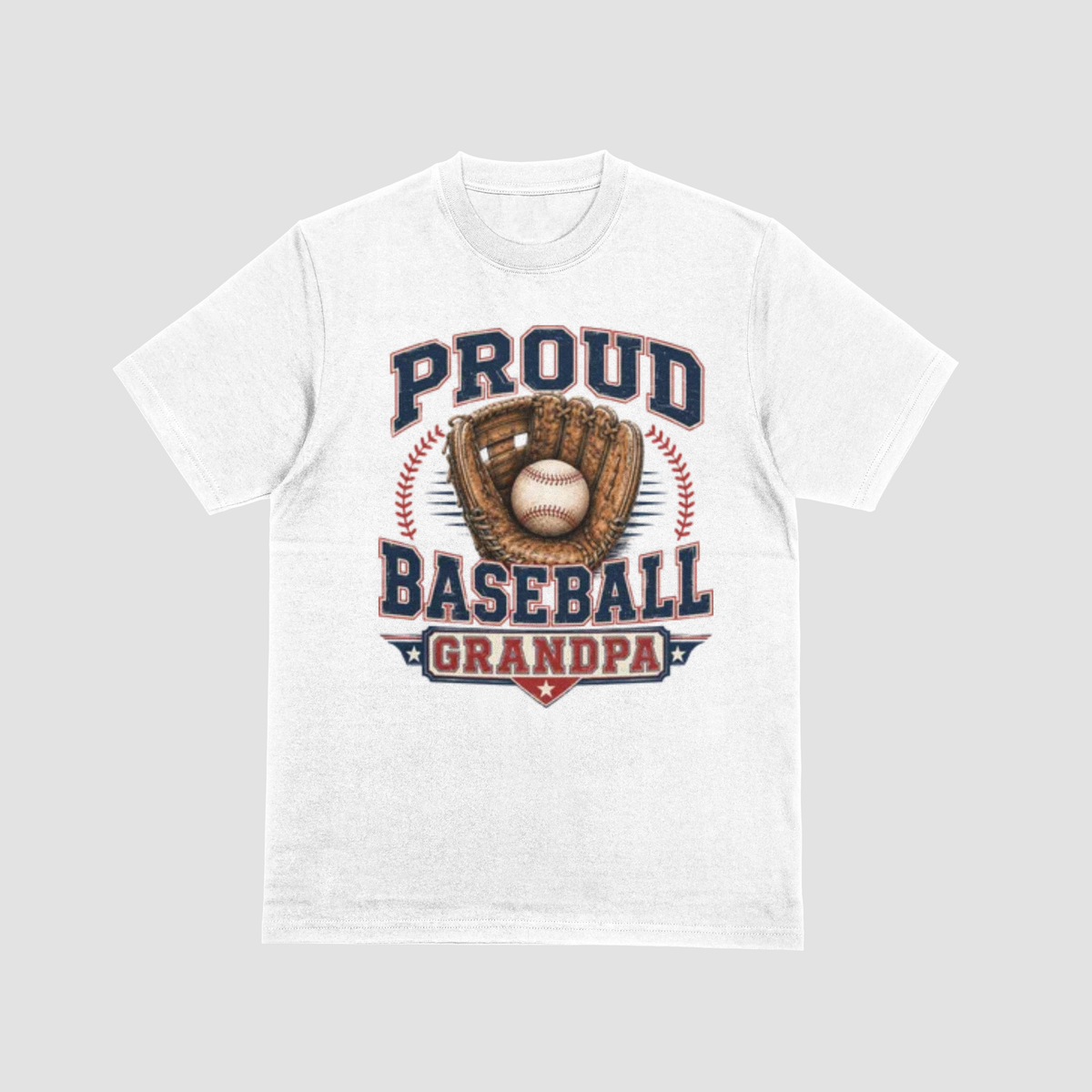 A white short-sleeve crewneck t-shirt featuring a vintage-style baseball graphic on the front. The graphic displays the text 'PROUD BASEBALL GRANDPA' in navy blue and red, surrounding an illustration of a baseball in a brown glove.