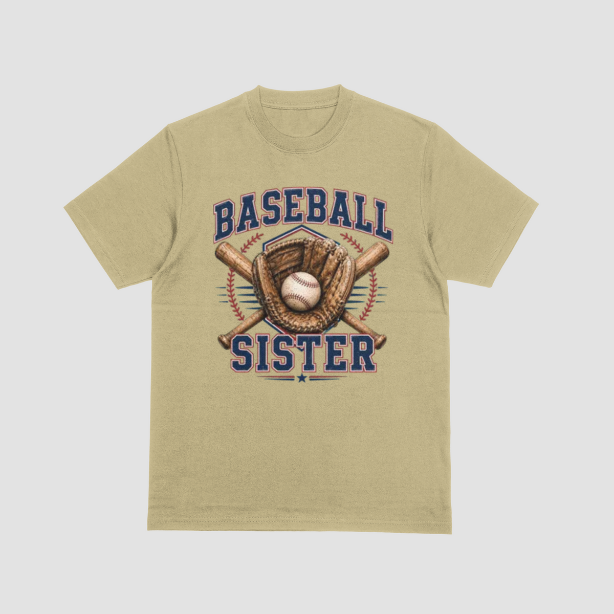 A sand color short-sleeve crewneck t-shirt featuring a 'Baseball Sister' graphic on the front. The graphic includes navy blue text, a brown baseball glove, a baseball, and crossed bats, set against a light gray background.