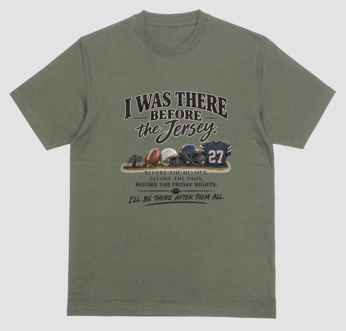 A military green short-sleeve t-shirt with a vintage-style football graphic on the chest. The graphic features footballs and a helmet and a jersey with the number 27, accompanied by the text 'I WAS THERE BEFORE the Jersey.