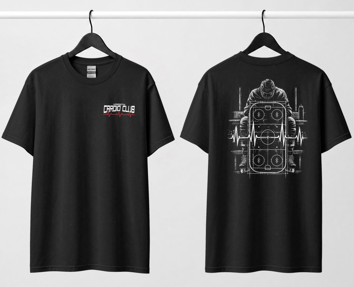 A black tee, front and back: small 'Varsity Cardio Club' chest logo, hockey player on bench over a rink and heartbeat line on back.