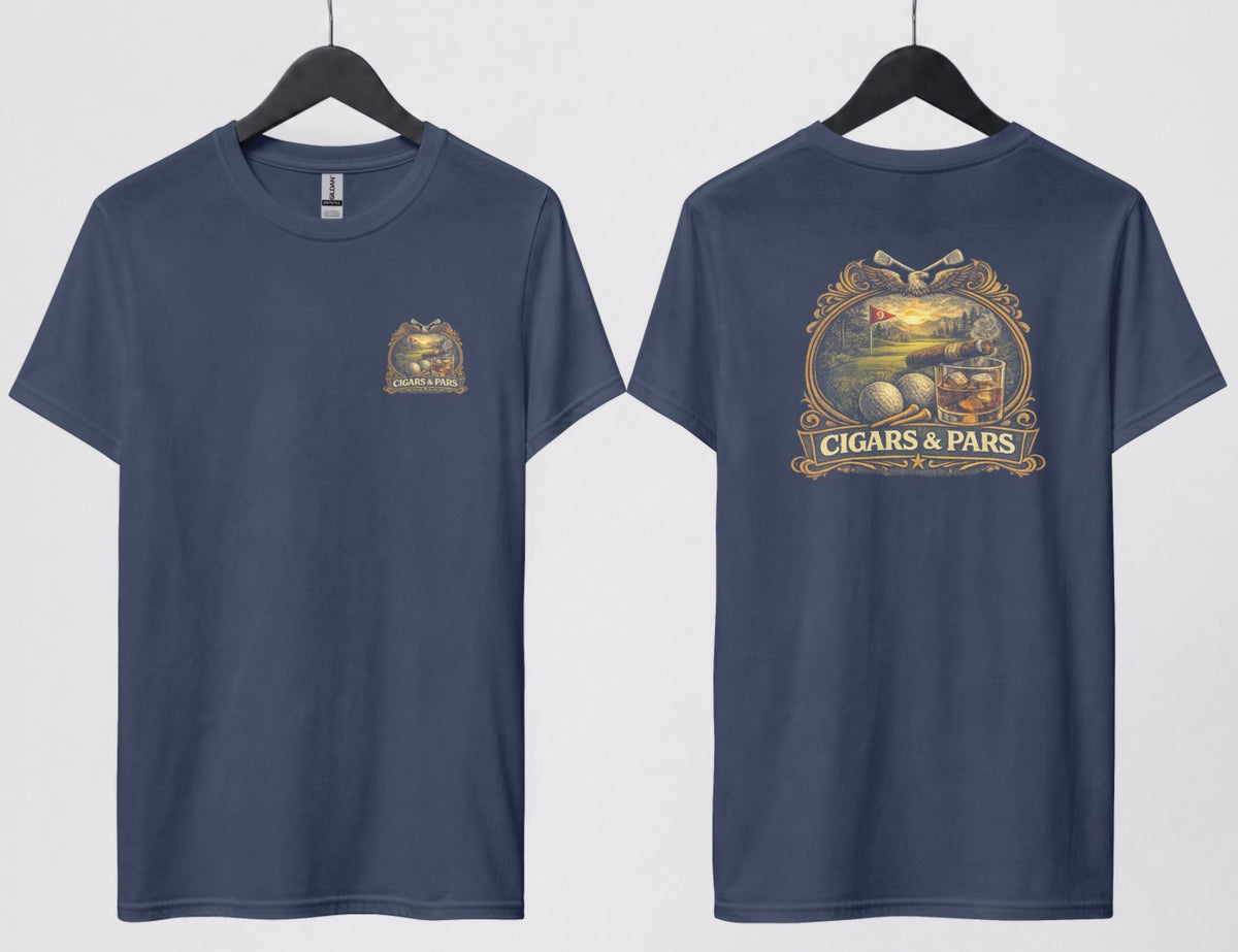 A navy blue t-shirt, front and back views on hangers. Front features a small crest-style graphic on the left chest with a golf course scene, crossed clubs, golf balls, and a cigar, framed above a banner reading 'Cigars & Pars.' Back features the same design enlarged: an eagle with crossed golf clubs above an oval scene of a golf green with a flag reading '9,' bordered below by golf balls, tees, a cigar, and a whiskey glass with ice, all above a decorative banner reading 'Cigars & Pars' with a star."