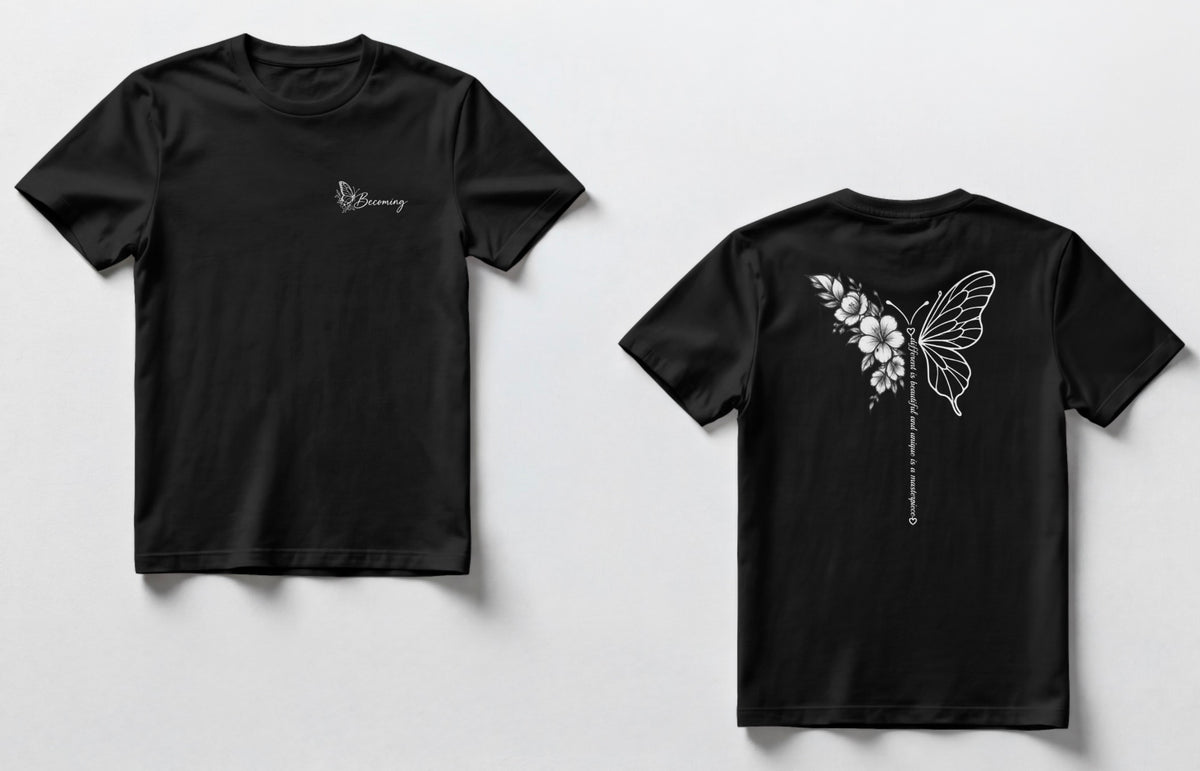 A black t-shirts shown side by side. The front has a small script logo on the chest, and the back has a white line-art butterfly with flowers and a vertical line of small text.”