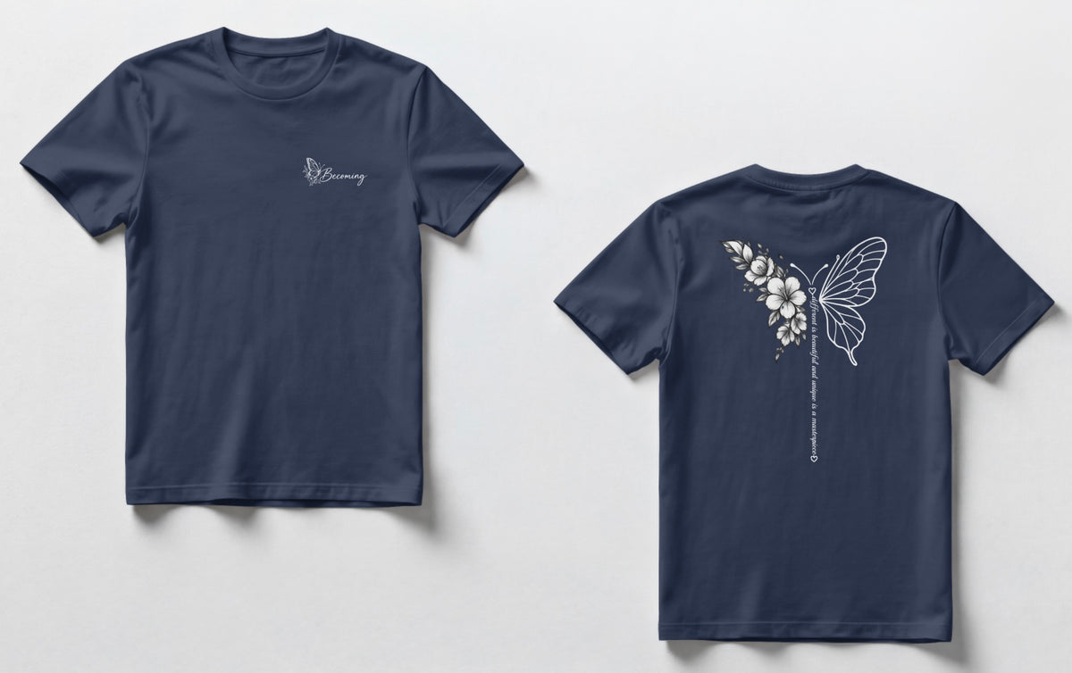 A navy blue  t-shirts shown side by side. The front has a small script logo on the chest, and the back has a white line-art butterfly with flowers and a vertical line of small text.”