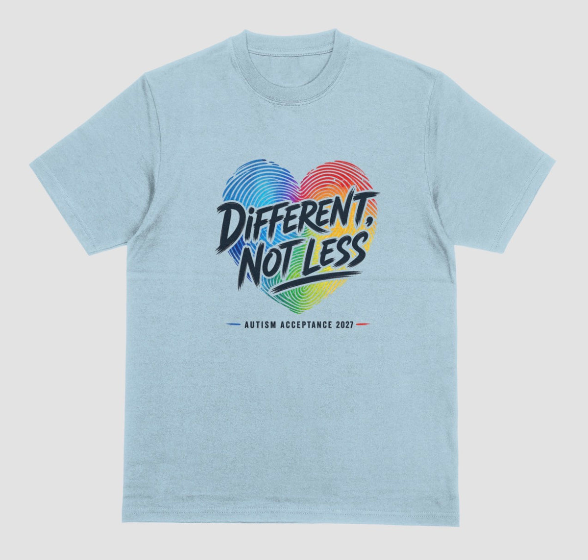 A light blue heather crewneck t-shirt featuring a colorful graphic on the chest. The graphic shows a heart made of blue and red fingerprint patterns with the text 'DIFFERENT, NOT LESS' in black and blue, and 'AUTISM ACCEPTANCE 2021' printed below in small black letters with red and blue accents.