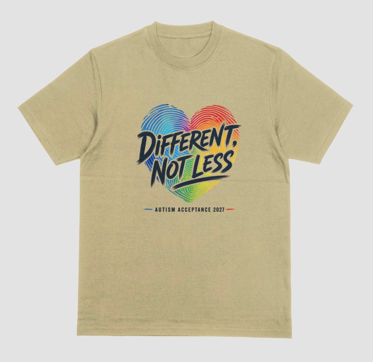A sand crewneck t-shirt featuring a colorful graphic on the chest. The graphic shows a heart made of blue and red fingerprint patterns with the text 'DIFFERENT, NOT LESS' in black and blue, and 'AUTISM ACCEPTANCE 2021' printed below in small black letters with red and blue accents.