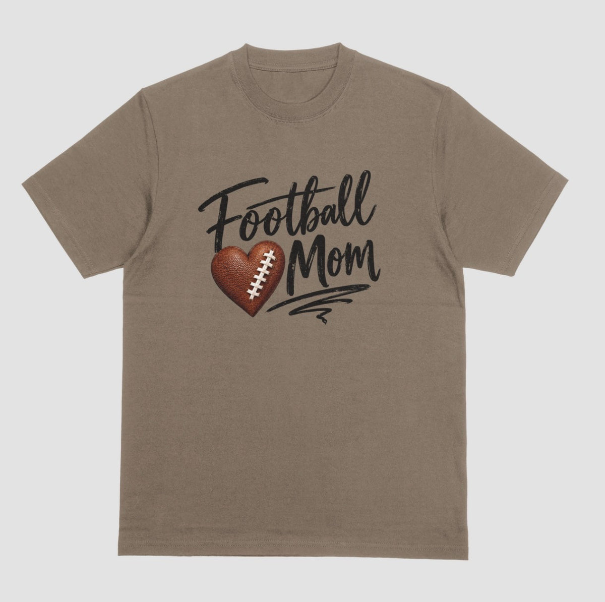 A brown savana crewneck T-shirt featuring 'Football Mom' text in black script lettering, with a football-textured heart design between the words