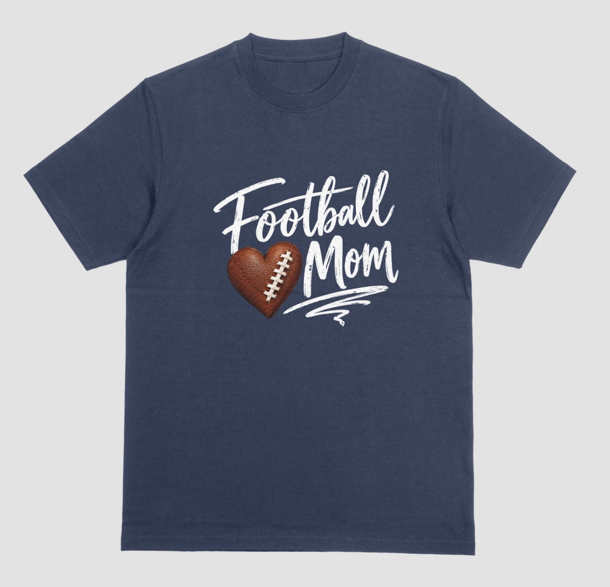 A navy blue crewneck T-shirt featuring 'Football Mom' text in black script lettering, with a football-textured heart design between the words