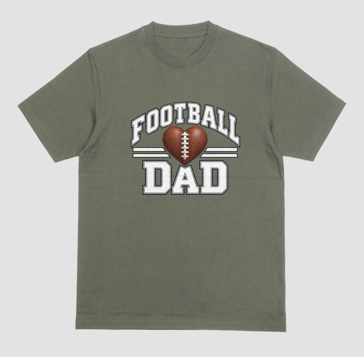 A military green short-sleeve t-shirt with a 'FOOTBALL DAD' graphic on the chest. The graphic features a brown heart-shaped football in the center, flanked by two white horizontal stripes, with 'FOOTBALL' arched above and 'DAD' printed below in a distressed white font.