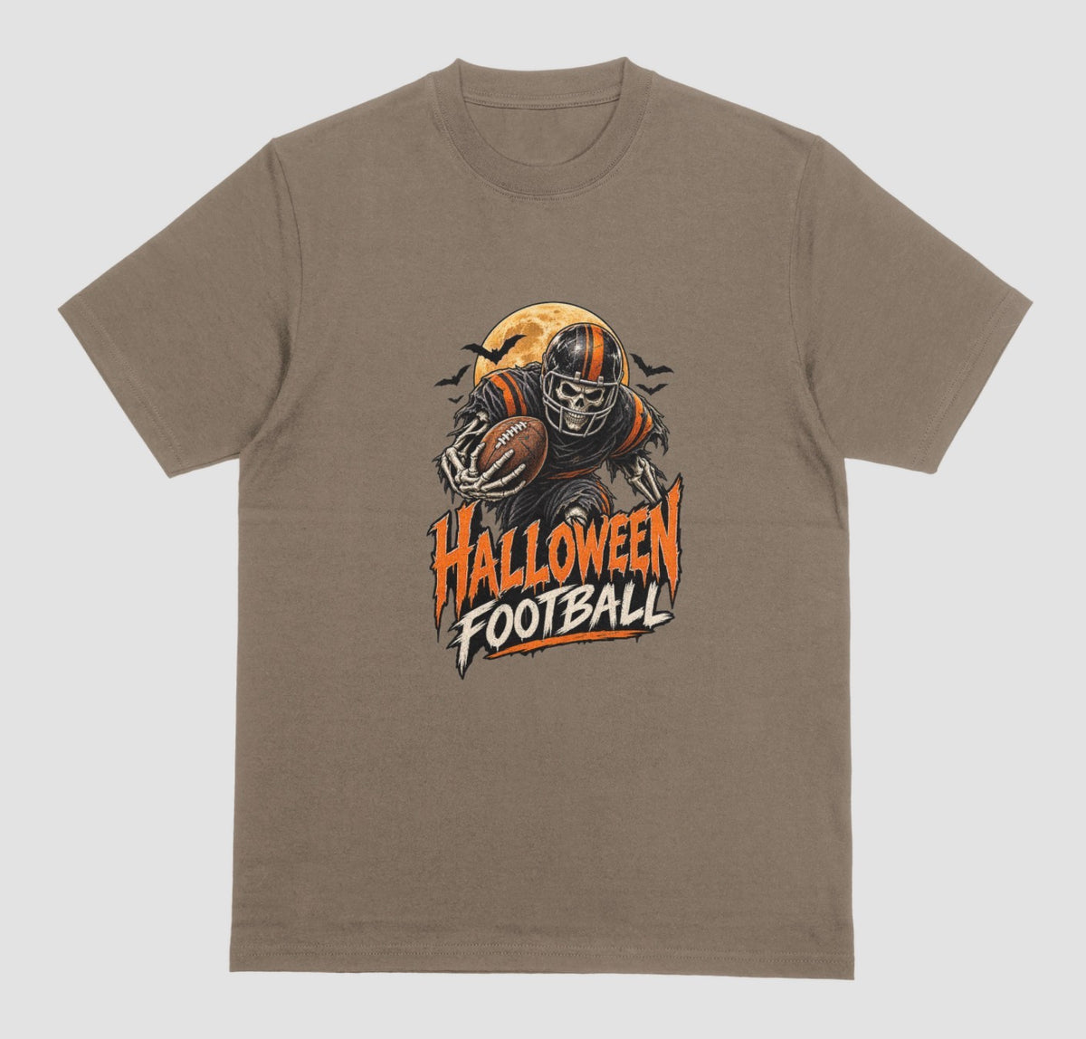 A brown savana t-shirt reading "Halloween Football" in orange and cream lettering, with a skeleton football player in a striped helmet carrying a football in front of a full moon and bats
