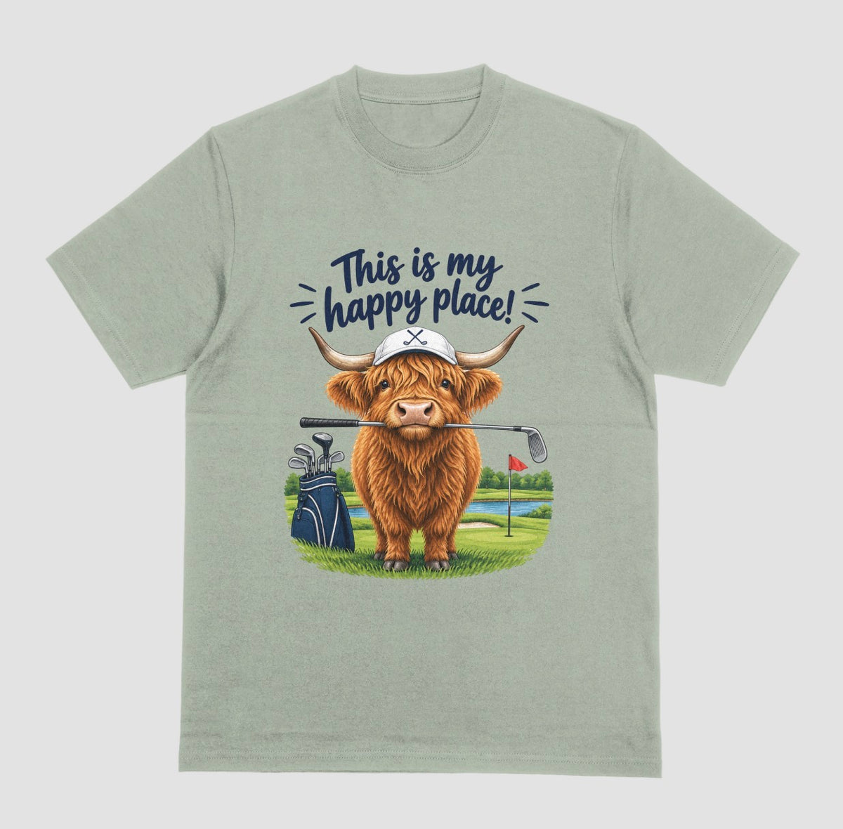 Sage — "Highland Cow This Is My Happy Place Golf t-shirt in sage with cute highland cow on a golf course"