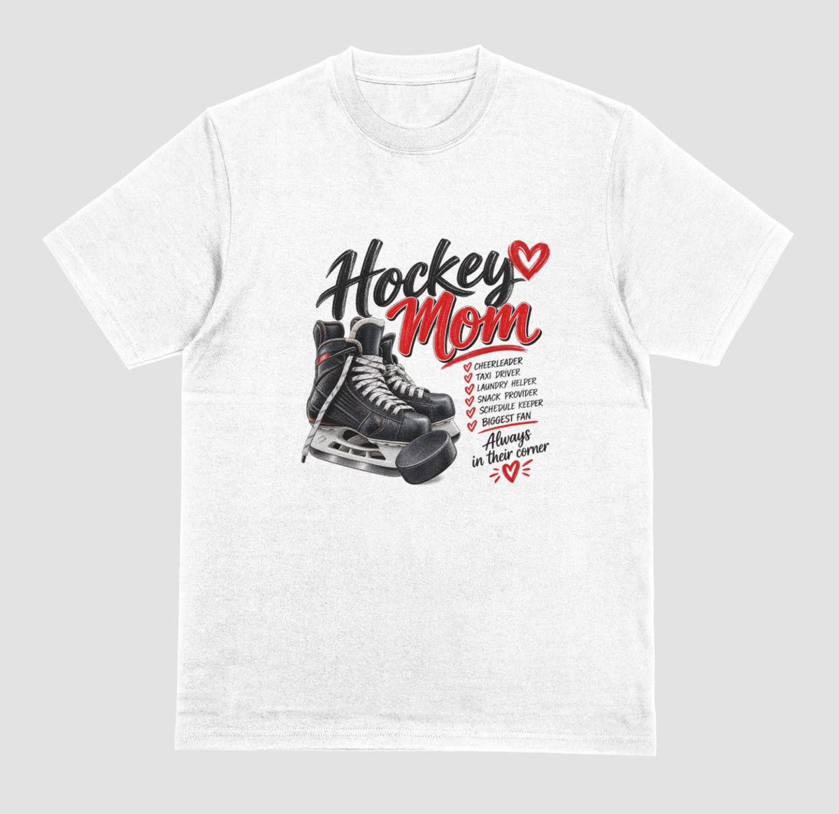 A white "Hockey Mom" t-shirt with black hockey skates, puck, and red heart design listing cheerleader, taxi driver, and biggest fan, with the tagline "Always in their corner"