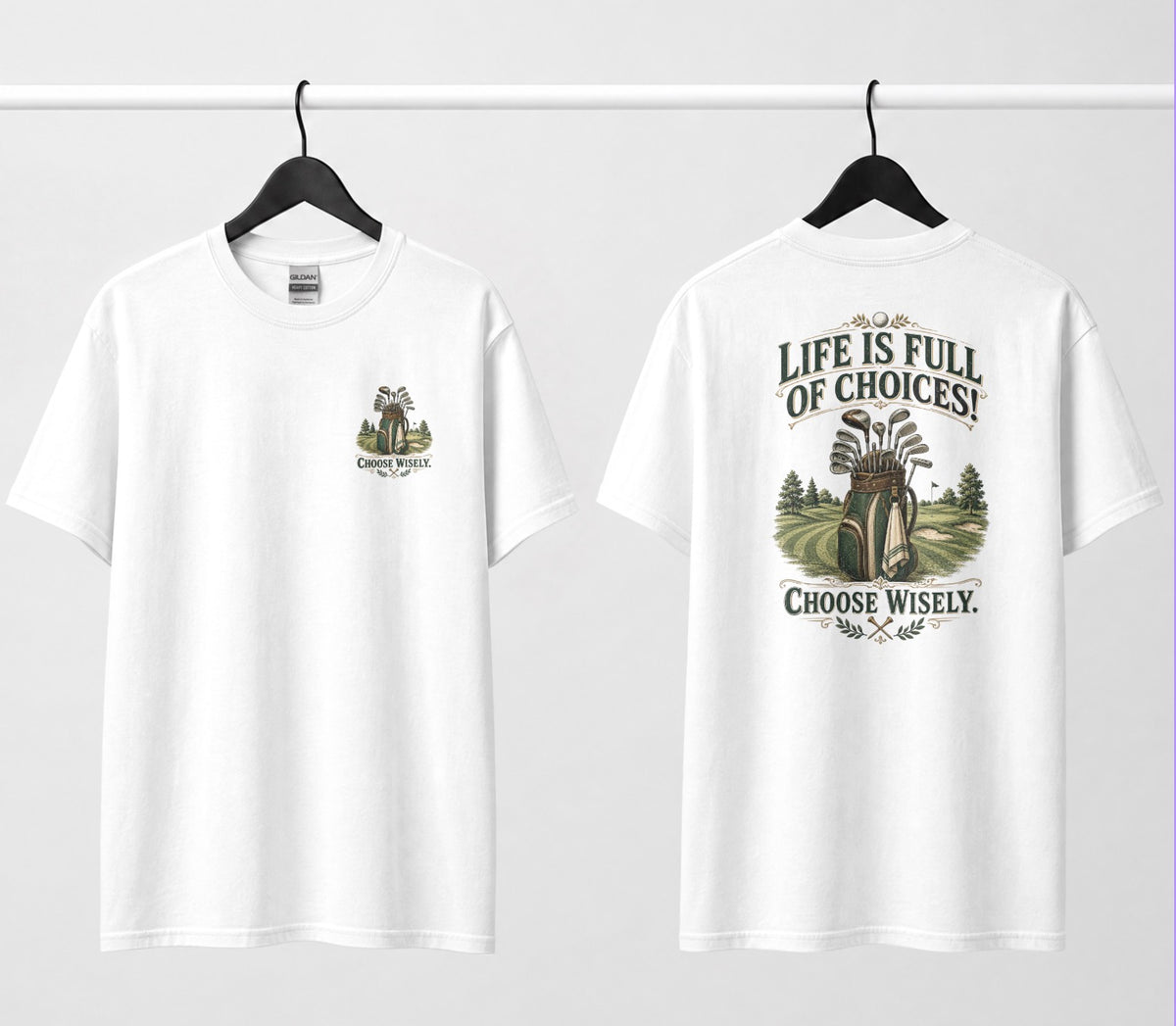 A white short-sleeve t-shirt shown from both the front and back, hanging on black hangers against a white wall. The design features a vintage-style illustration of a golf bag filled with clubs on a golf course, framed by the text 'LIFE IS FULL OF CHOICES! CHOOSE Wisely.