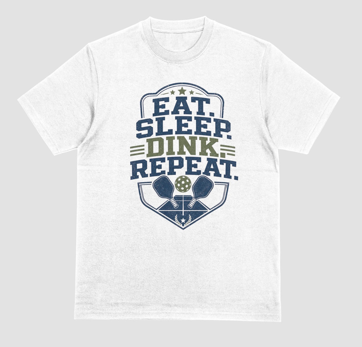 A white crewneck t-shirt featuring a distressed graphic on the front with the text 'EAT. SLEEP. DINK. REPEAT.'