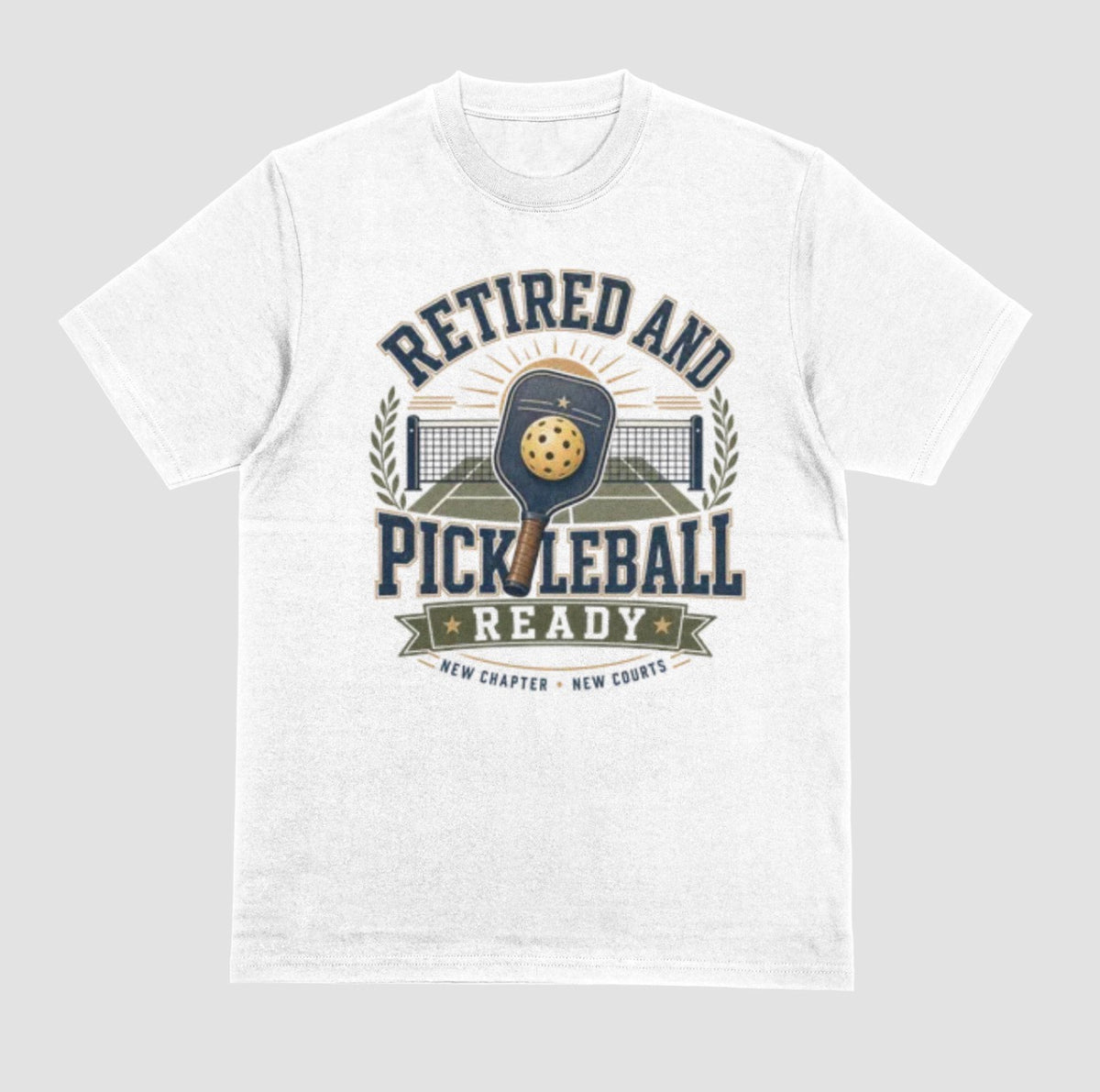 A white crewneck t-shirt with the saying 'RETIRED AND PICKLEBALL READY' with a pickleball and paddle displayed with a vintage style.