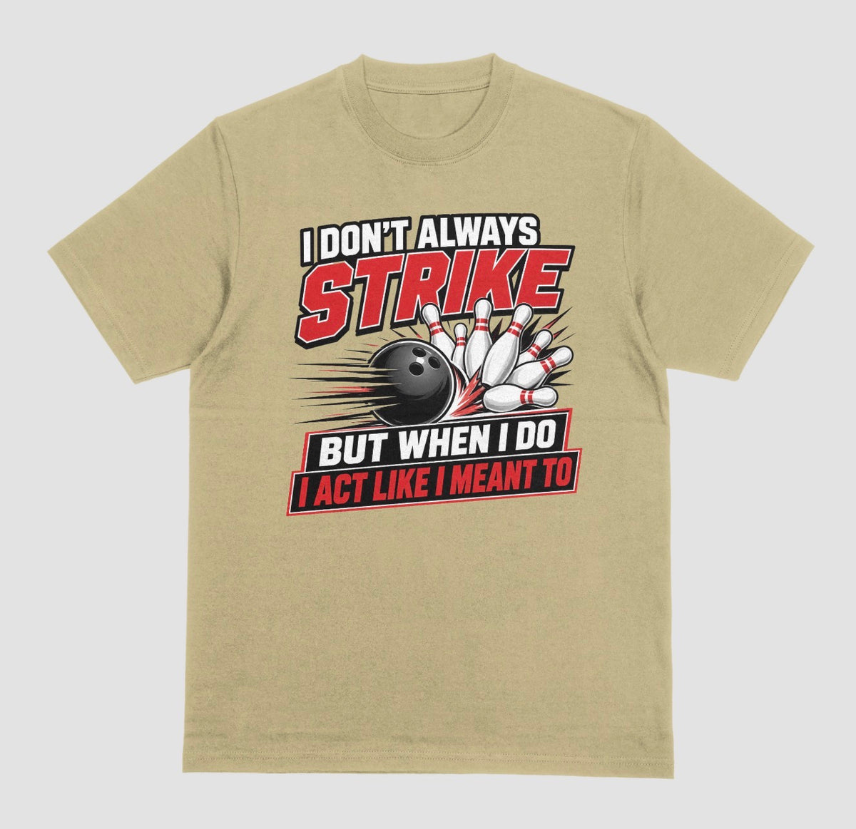 A sand color short-sleeve t-shirt with a bowling-themed graphic on the front. The graphic features the text 'I DON'T ALWAYS STRIKE BUT WHEN I DO I ACT LIKE I MEANT TO' in white and red lettering, surrounding an illustration of a black bowling ball and white bowling pins. | Where We Play Apparel