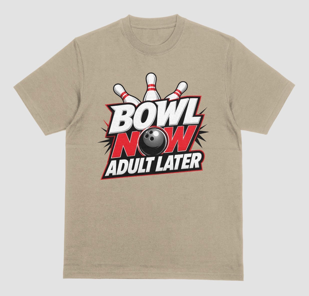 A prairie dust crewneck t-shirt featuring a bowling-themed graphic on the chest with the text 'BOWL NOW ADULT LATER' and a bowling ball and pins. | Where We Play Apparel