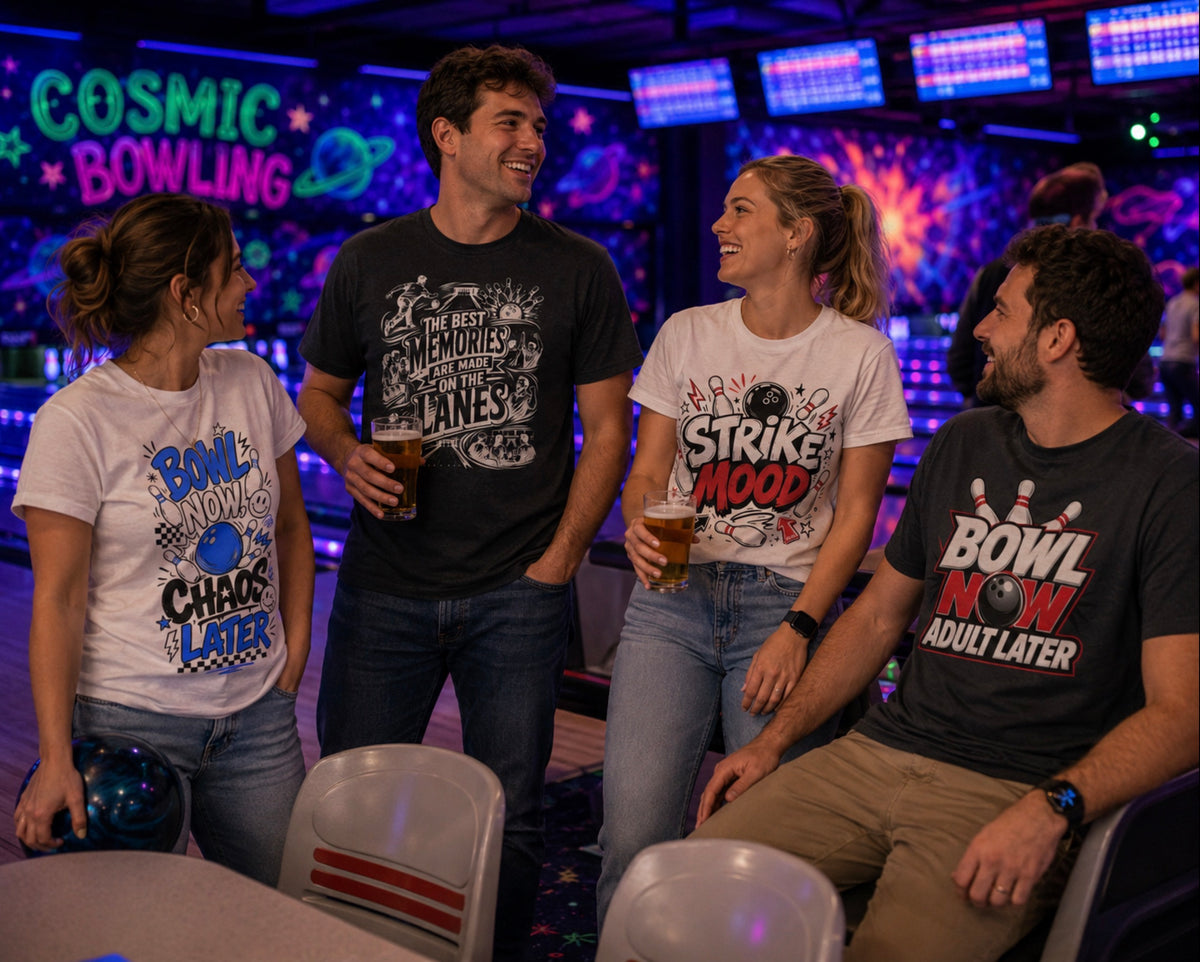 Four friends laughing in a bowling alley wearing bowling graphic t-shirts with bowling-themed slogans like 'BOWL NOW CHAOS LATER' and 'STRIKE MOOD' 'The Best Memories Are Made On The Lanes' and 'BOWL NOW ADULT LATER'