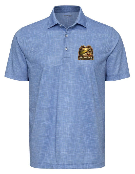 A blue sky crosshatch-patterned Paragon premium polo shirt, front view, with a left chest crest-style graphic featuring a golf course scene with a flag and golf ball, framed by decorative crossed clubs, above a banner reading 'Cigars & Pars.'