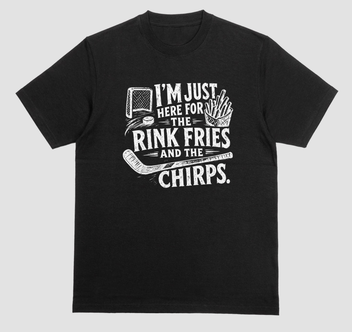 A black t-shirt with white distressed hockey graphic reading “I’m just here for the rink fries and the chirps” with a hockey net, puck, stick, and fries