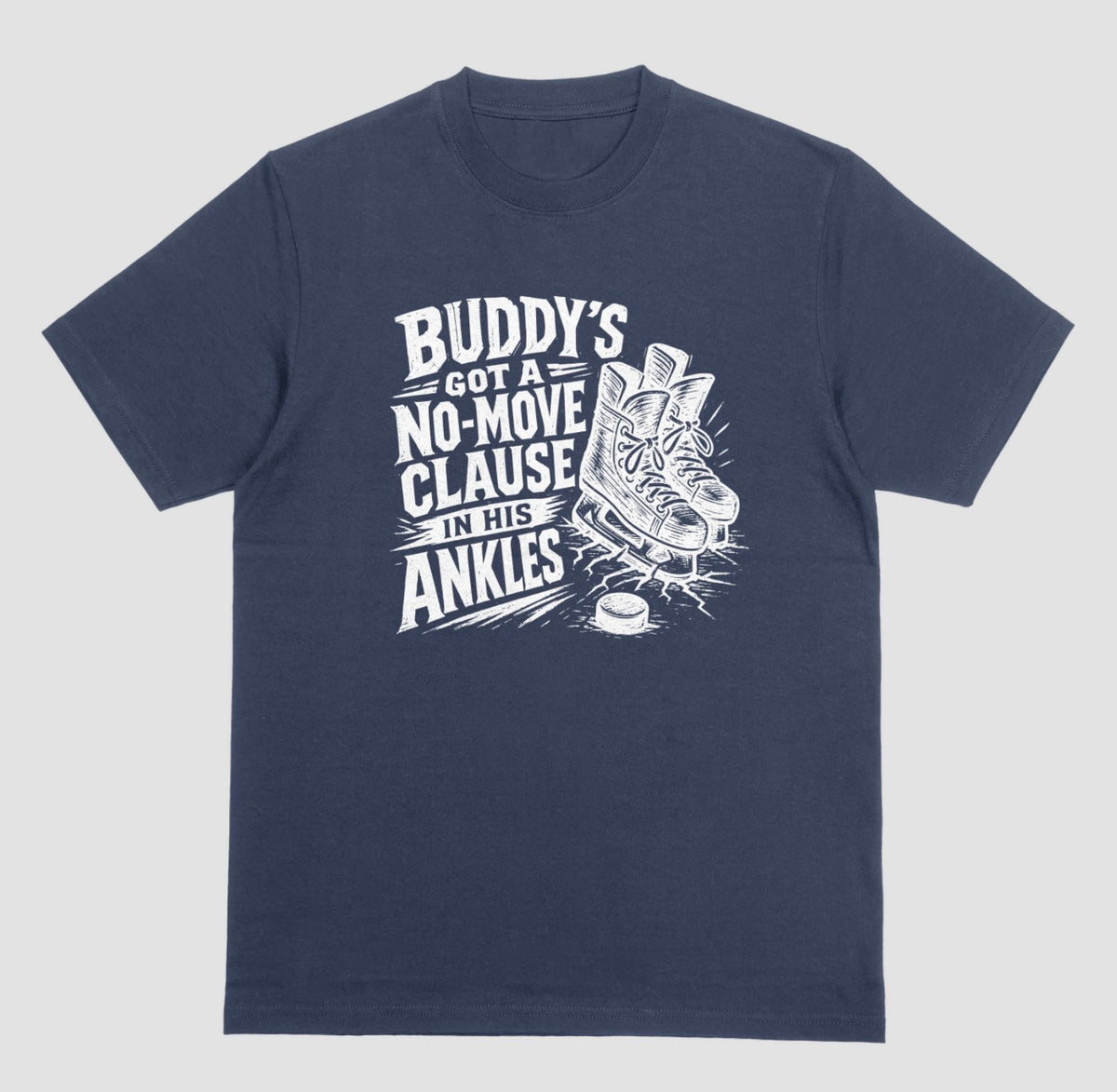 A navy blue funny hockey t-shirt with white graphic of ice skates and a puck, reading “Buddy’s got a no-move clause in his ankles”