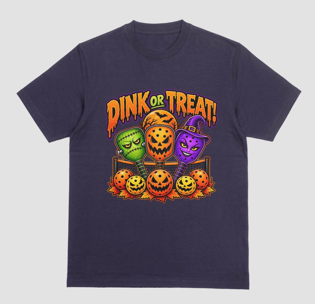 A blackberry t-shirt with “Dink or Treat!” Halloween design of three spooky pickleball paddles and jack-o’-lantern pickleballs