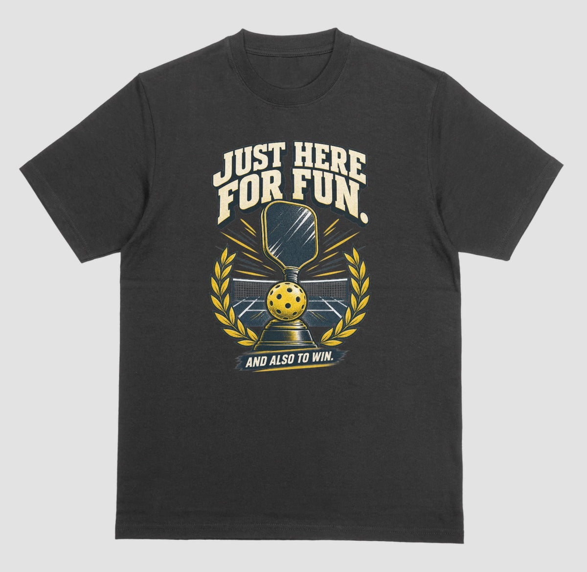 A black Funny pickleball shirt with a trophy, paddle and laurel wreath design that says Just Here for Fun and Also to Win