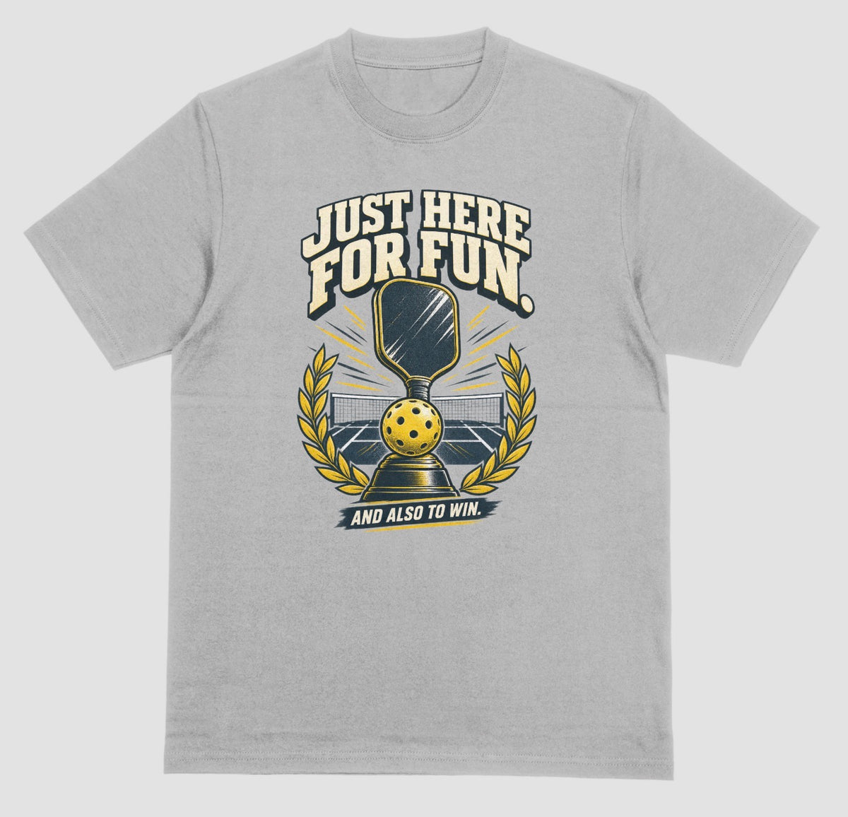 A grey Funny pickleball shirt with a trophy, paddle and laurel wreath design that says Just Here for Fun and Also to Win