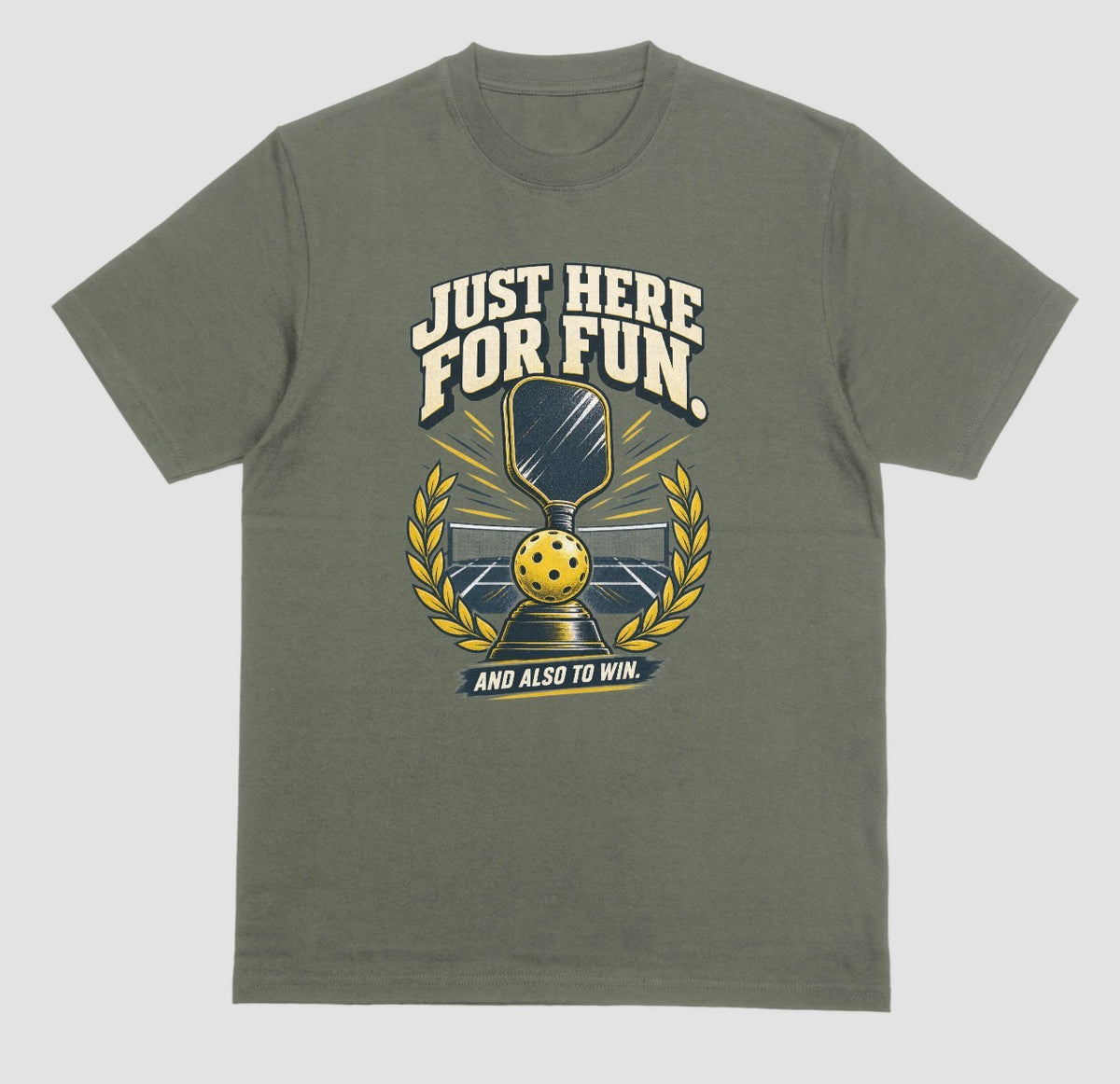 A military green Funny pickleball shirt with a trophy, paddle and laurel wreath design that says Just Here for Fun and Also to Win