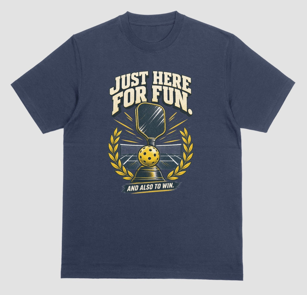 A navy blue Funny pickleball shirt with a trophy, paddle and laurel wreath design that says Just Here for Fun and Also to Win