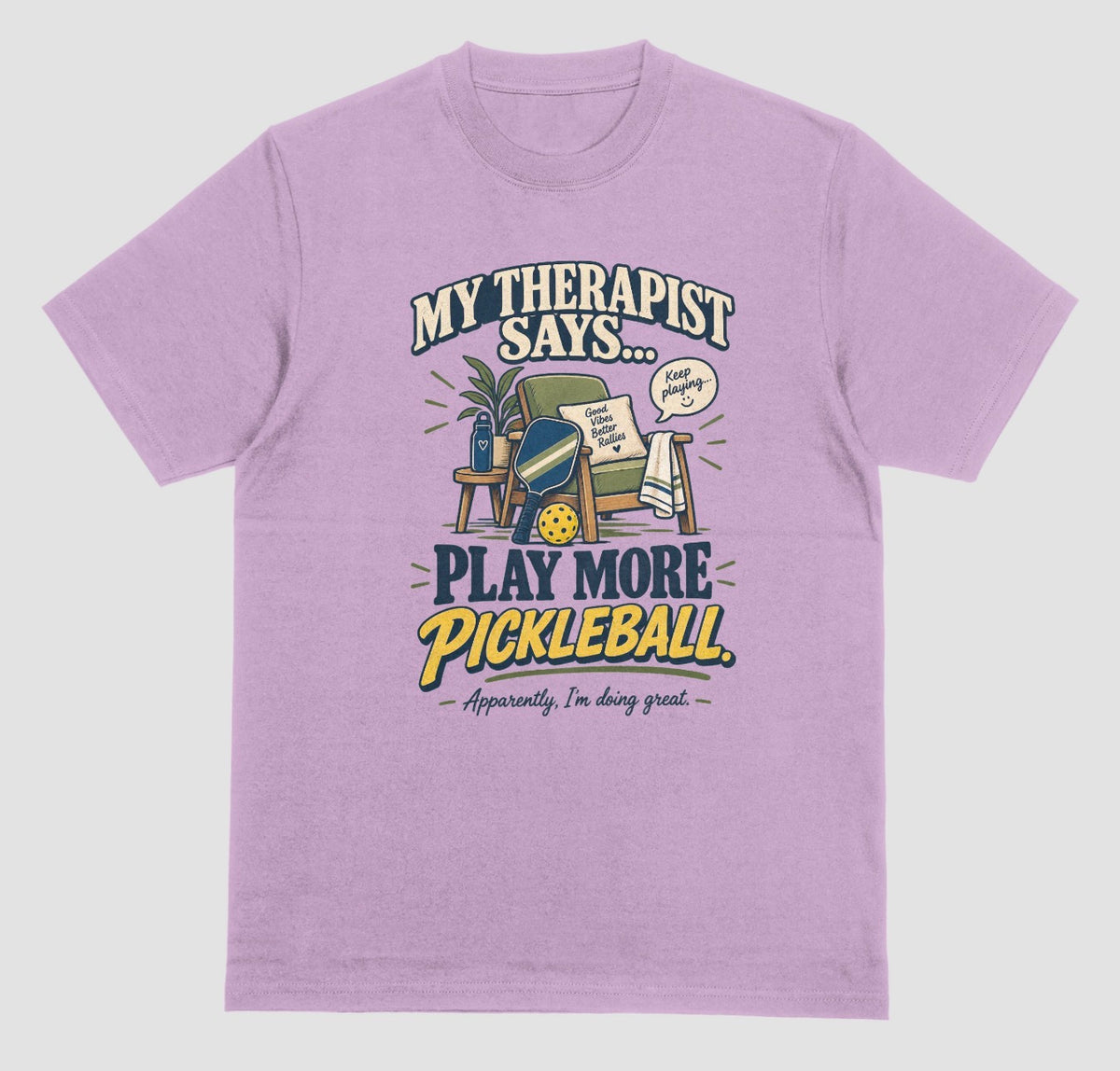 A light orchid Funny pickleball shirt with an armchair and paddle design that says My Therapist Says Play More Pickleball