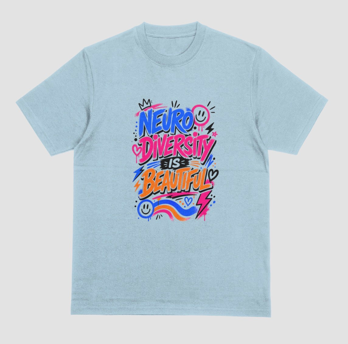 A light blue short-sleeve crewneck t-shirt featuring a colorful graphic on the chest that reads 'NEURO DIVERSITY IS BEAUTIFUL' in stylized, graffiti-like lettering with pink, blue, orange, and purple accents.