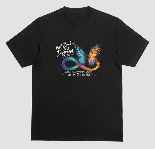 A black t-shirt with a colorful butterfly and rainbow infinity symbol, with the text ‘Not Broken, Just Different’ and ‘Autism is a different way of seeing the world.’