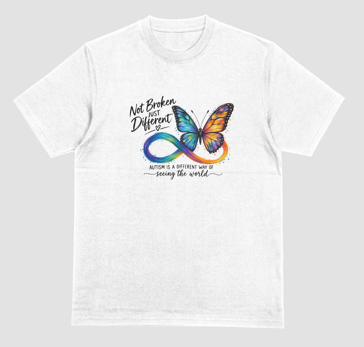 a white t-shirt with a colorful butterfly and rainbow infinity symbol, with the text ‘Not Broken, Just Different’ and ‘Autism is a different way of seeing the world.’