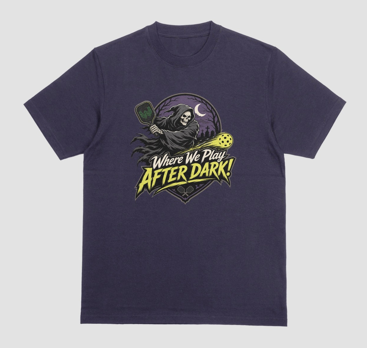 A blackberry t-shirt with a spooky pickleball graphic reading 'Where We Play After Dark!' showing a hooded grim reaper swinging a paddle at a glowing yellow ball.