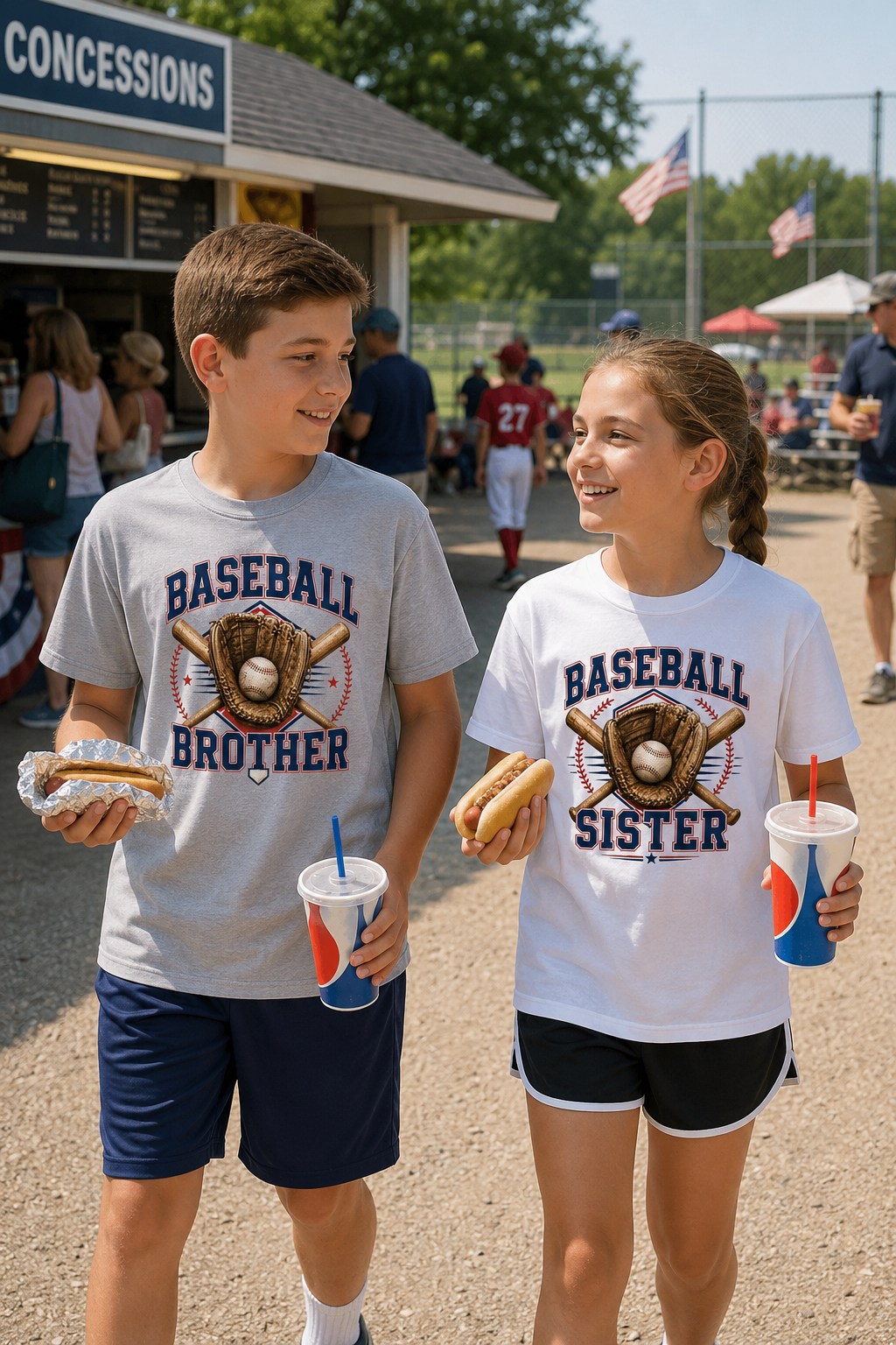 A boy and a girl walking together at a baseball game, both wearing matching graphic t-shirts. The boy's shirt is light gray with 'BASEBALL BROTHER' and the girl's shirt is white with 'BASEBALL SISTER' printed in navy blue, both featuring a baseball glove and ball graphic.