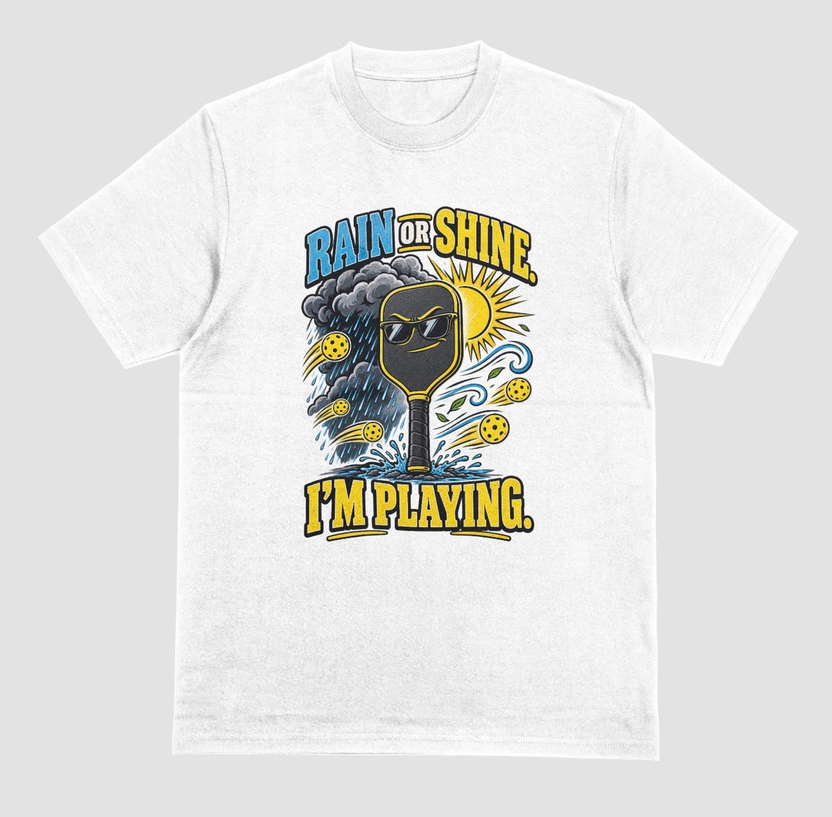 A white Funny pickleball shirt with a sunglasses paddle, storm cloud and sun that says Rain or Shine, I’m Playing