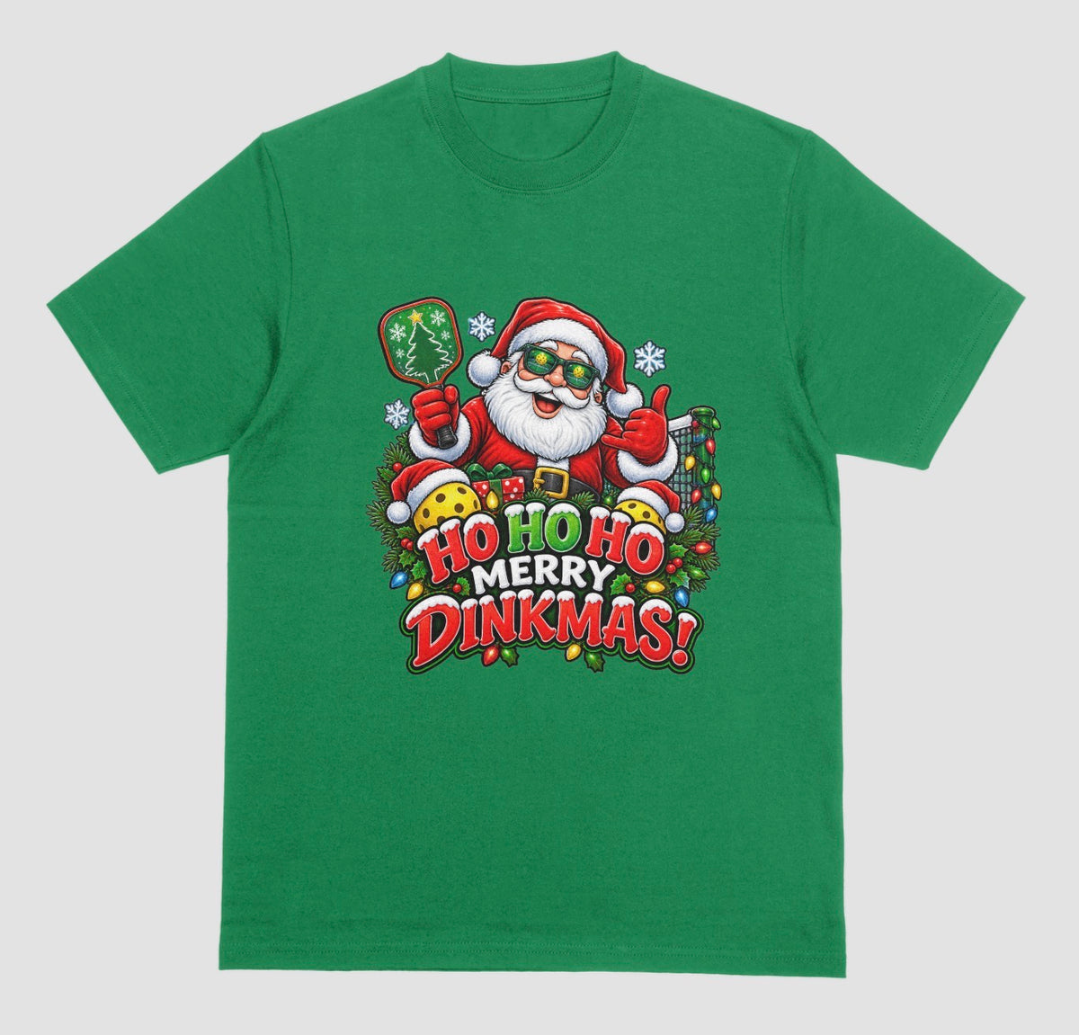 A green “Ho Ho Ho Merry Dinkmas” Christmas pickleball t-shirt with Santa holding a paddle