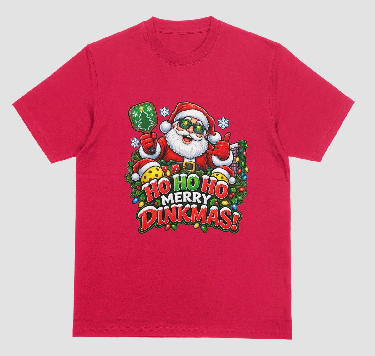 A red “Ho Ho Ho Merry Dinkmas” Christmas pickleball t-shirt with Santa holding a paddle