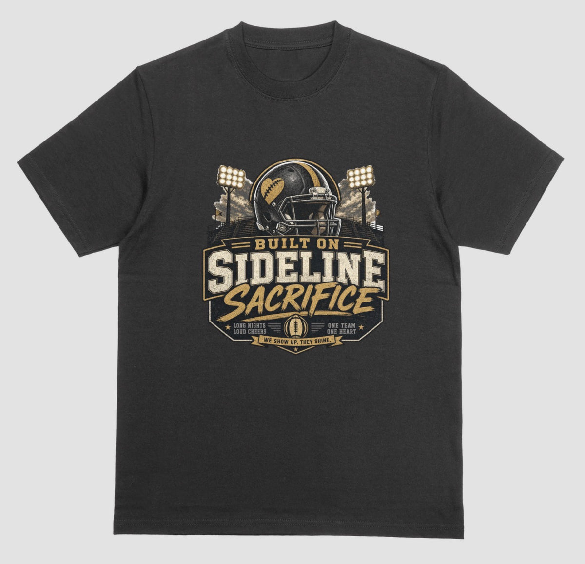 A black crewneck t-shirt featuring a football-themed graphic on the chest with the text 'BUILT ON SIDELINE SACRIFICE' and a helmet illustration, shown against a light gray background.