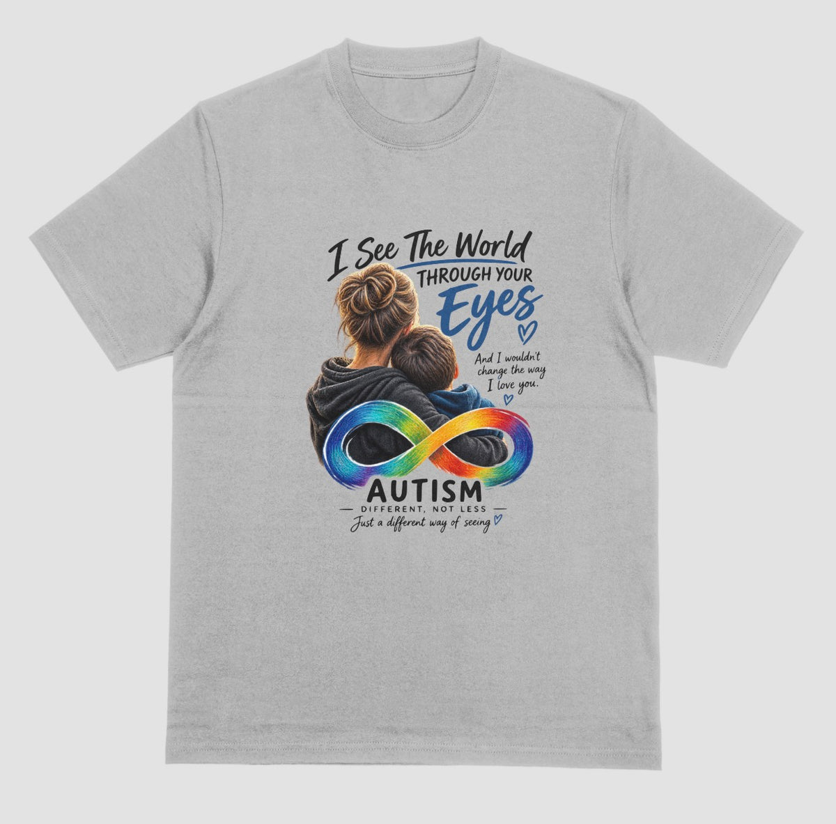 A grey t-shirt with a graphic of a parent hugging a child, a rainbow infinity symbol, and the text ‘I See the World Through Your Eyes’ and ‘Autism: Different, Not Less.’